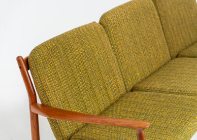Impressive 3-seater sofa by Grete Jalk for Glostrup (Denmark, 1960s). What an eye catcher.. it features a solid teak frame which is beautifully sculpted and the original cushions! The green/yellow wool fabric is original aswell and remains in amazing condition. Obviously an example of true Scandinavian craftsmanship. It is a pleasure for the eyes and a pleasure to sit in! Marked by maker.
