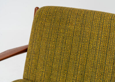 Impressive 3-seater sofa by Grete Jalk for Glostrup (Denmark, 1960s). What an eye catcher.. it features a solid teak frame which is beautifully sculpted and the original cushions! The green/yellow wool fabric is original aswell and remains in amazing condition. Obviously an example of true Scandinavian craftsmanship. It is a pleasure for the eyes and a pleasure to sit in! Marked by maker.