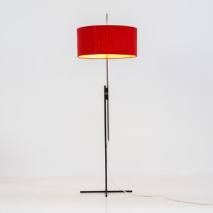 Rare minimalist floor lamp by Kaiser Leuchten (Germany, 1960s).It contains a minimalistic black base, a chrome arm and the original large fabric shade with a red & black check pattern.It is adjustable in height with a clamping mechanism. The light comes out primarily directed downwards and upwards.The lamp has a pull cord as a switch. It has 3 switching modes. The 2 burning points can be turned on and off individually, so that only one bulb burns when needed.In very good and original condition with a few sings of age and use.Labeled by maker.