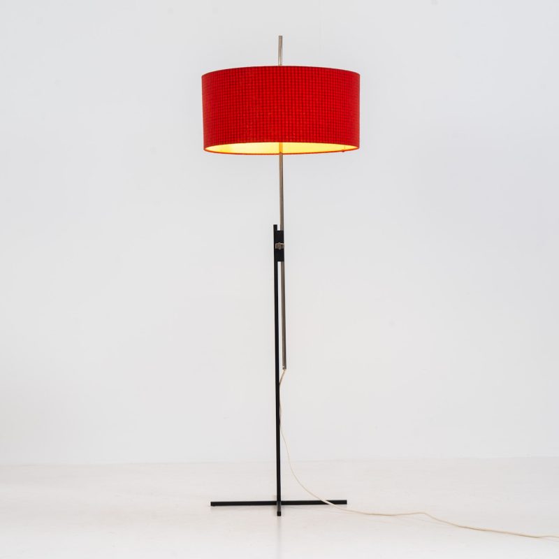 Rare minimalist floor lamp by Kaiser Leuchten (Germany, 1960s).It contains a minimalistic black base, a chrome arm and the original large fabric shade with a red & black check pattern.It is adjustable in height with a clamping mechanism. The light comes out primarily directed downwards and upwards.The lamp has a pull cord as a switch. It has 3 switching modes. The 2 burning points can be turned on and off individually, so that only one bulb burns when needed.In very good and original condition with a few sings of age and use.Labeled by maker.