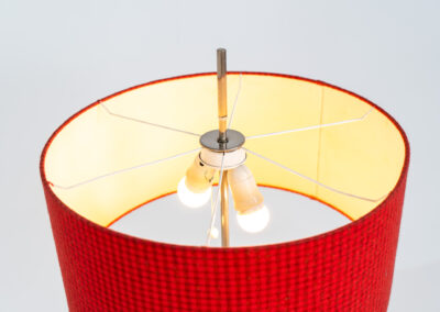 Rare minimalist floor lamp by Kaiser Leuchten (Germany, 1960s).It contains a minimalistic black base, a chrome arm and the original large fabric shade with a red & black check pattern.It is adjustable in height with a clamping mechanism. The light comes out primarily directed downwards and upwards.The lamp has a pull cord as a switch. It has 3 switching modes. The 2 burning points can be turned on and off individually, so that only one bulb burns when needed.In very good and original condition with a few sings of age and use.Labeled by maker.