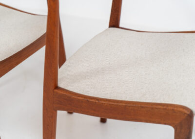 Elegant set of 4 rare dining chairs by Henning Kjaernulf for Korup Stolefabrik (Denmark, 1960s). These beauties are made of solid teak, featuring clean lines, organic curves and expert craftsmanship. They are newly upholstered in a high quality off-white cotton & hemp fabric. Fully restored and in splendid condition.