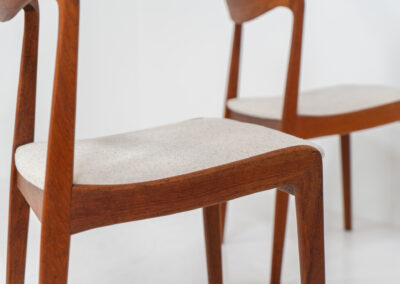 Elegant set of 4 rare dining chairs by Henning Kjaernulf for Korup Stolefabrik (Denmark, 1960s). These beauties are made of solid teak, featuring clean lines, organic curves and expert craftsmanship. They are newly upholstered in a high quality off-white cotton & hemp fabric. Fully restored and in splendid condition.