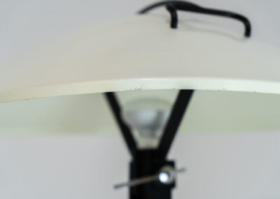 Radar table lamp by Elio Martinelli for Martinelli Luce (Italy, 1970s). This highly sought-after masterpiece features a unique circular shape resembling a radar dish, with a light source at its center. The lamp’s sleek and futuristic design makes it a timeless piece of functional art. The shade is adjustable with a chrome lever. In very good and original condition with a few scratches, visible on the pictures.