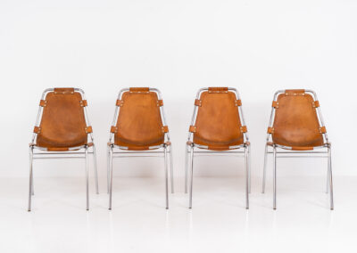 Stunning set of 4 ‘Les Arcs’ chairs selected by Charlotte Perriand for Les Arcs and produced by Cassina (Italy, 1960s). Charlotte Perriand collaborated with Jean Prouvé and Pierre Jeanneret for this iconic design. They are made out of a chrome tubular frame and a cow leather cognac upholstery. Characterized by their sleek metal frames and ergonomic design, they reflect Perriand’s commitment to both form and function, embodying the modernist aesthetic of the time. The Les Arcs chairs remain iconic pieces of furniture and highly collectible. In very good condition with a beautiful patina on the leather!