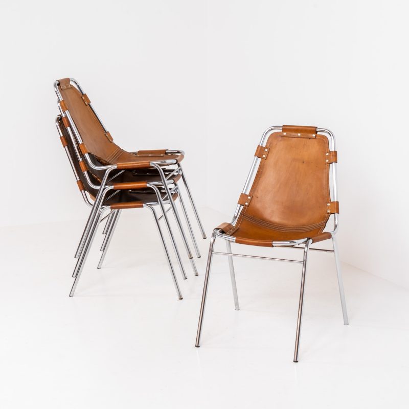 Stunning set of 4 ‘Les Arcs’ chairs selected by Charlotte Perriand for Les Arcs and produced by Cassina (Italy, 1960s). Charlotte Perriand collaborated with Jean Prouvé and Pierre Jeanneret for this iconic design. They are made out of a chrome tubular frame and a cow leather cognac upholstery. Characterized by their sleek metal frames and ergonomic design, they reflect Perriand’s commitment to both form and function, embodying the modernist aesthetic of the time. The Les Arcs chairs remain iconic pieces of furniture and highly collectible. In very good condition with a beautiful patina on the leather!