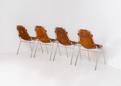 Stunning set of 4 ‘Les Arcs’ chairs selected by Charlotte Perriand for Les Arcs and produced by Cassina (Italy, 1960s). Charlotte Perriand collaborated with Jean Prouvé and Pierre Jeanneret for this iconic design. They are made out of a chrome tubular frame and a cow leather cognac upholstery. Characterized by their sleek metal frames and ergonomic design, they reflect Perriand’s commitment to both form and function, embodying the modernist aesthetic of the time. The Les Arcs chairs remain iconic pieces of furniture and highly collectible. In very good condition with a beautiful patina on the leather!