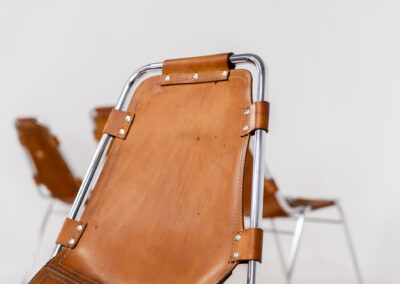 Stunning set of 4 ‘Les Arcs’ chairs selected by Charlotte Perriand for Les Arcs and produced by Cassina (Italy, 1960s). Charlotte Perriand collaborated with Jean Prouvé and Pierre Jeanneret for this iconic design. They are made out of a chrome tubular frame and a cow leather cognac upholstery. Characterized by their sleek metal frames and ergonomic design, they reflect Perriand’s commitment to both form and function, embodying the modernist aesthetic of the time. The Les Arcs chairs remain iconic pieces of furniture and highly collectible. In very good condition with a beautiful patina on the leather!