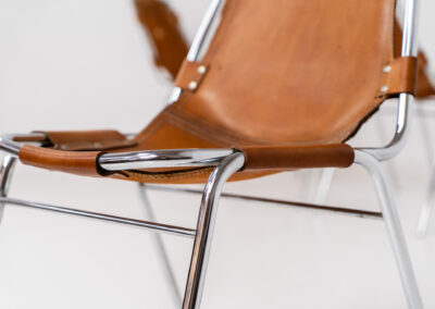 Stunning set of 4 ‘Les Arcs’ chairs selected by Charlotte Perriand for Les Arcs and produced by Cassina (Italy, 1960s). Charlotte Perriand collaborated with Jean Prouvé and Pierre Jeanneret for this iconic design. They are made out of a chrome tubular frame and a cow leather cognac upholstery. Characterized by their sleek metal frames and ergonomic design, they reflect Perriand’s commitment to both form and function, embodying the modernist aesthetic of the time. The Les Arcs chairs remain iconic pieces of furniture and highly collectible. In very good condition with a beautiful patina on the leather!