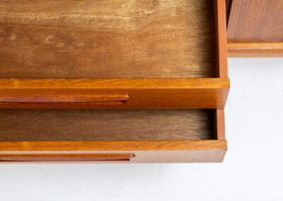 Beautiful Danish sideboard in teak, 1960s. The designer is unknown for now, but it is clearly a well-built and very aesthetic piece! It contains two sliding doors with shelves on the inside and four drawers with stunning organic inset handles on them. Another feature on this one is that it has a veneered backside, so it can be placed in the center of a room, as a room devider for example. The sideboard is in very good condition!