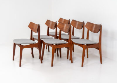 Set of 6 teak dining chairs by Erik Buch for Funder-Schmidt & Madsen (Denmark, 1950s). Durable Danish quality and a beautiful design, made out of teak. They have nice organic lines and the typical floating seats. The chairs are fully restored and newly upholstered in a grey fabric. Ready for another lifetime. Burn marked by maker.