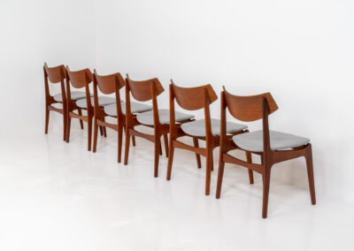 Set of 6 teak dining chairs by Erik Buch for Funder-Schmidt & Madsen (Denmark, 1950s). Durable Danish quality and a beautiful design, made out of teak. They have nice organic lines and the typical floating seats. The chairs are fully restored and newly upholstered in a grey fabric. Ready for another lifetime. Burn marked by maker.