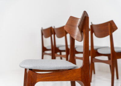 Set of 6 teak dining chairs by Erik Buch for Funder-Schmidt & Madsen (Denmark, 1950s). Durable Danish quality and a beautiful design, made out of teak. They have nice organic lines and the typical floating seats. The chairs are fully restored and newly upholstered in a grey fabric. Ready for another lifetime. Burn marked by maker.