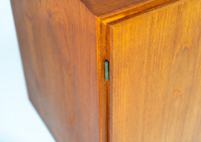 Midcentury cabinet by Børge Mogensen for Søborg Møbelfabrik (Denmark, 1960s). A simple and well-built piece by one of Denmark’s most influential designers, Børge Mogensen. It contains two doors with stunningly sculpted handles. Except for a small restoration mark on the back corner this piece is in wonderful condition. Labeled by maker and original key included.