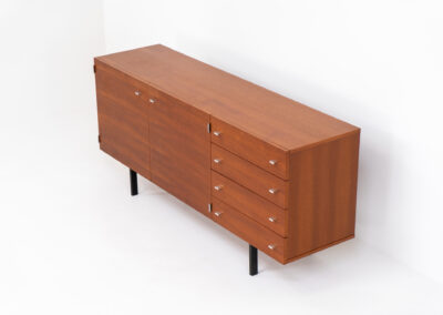 Modernist “1864” sideboard by Pierre Guariche for Meurop (Belgium, 1960s). A beautiful example of Belgian modernism! It features a warm meranti woodgrain, a sleek black lacquered metal frame and aluminium handles. It remains in very good condition with normal using traces.