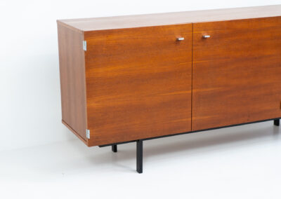 Modernist “1864” sideboard by Pierre Guariche for Meurop (Belgium, 1960s). A beautiful example of Belgian modernism! It features a warm meranti woodgrain, a sleek black lacquered metal frame and aluminium handles. It remains in very good condition with normal using traces.