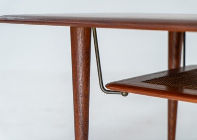 Highly collectible FD-516 coffee table by Peter Hvidt & Orla Mølgaard for France & Søn (Denmark, 1960s). This rare and important FD-516 model features a solid teak table top and solid legs. It has an additional magazine area made of rattan mesh, which is worn by brass fittings. An example of a highly detailed and high quality Scandinavian design classic in very good condition. Marked by maker.