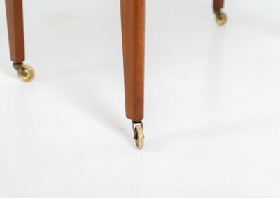 Danish trolley / sidetable in teak, 1960s A simple rolling sidetable with one drawer featuring a nicely sculpted handle, a warm woodgrain and some brass details on the wheels. In good condition with normal using traces.