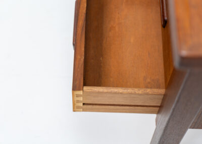 Freestanding writing desk by Gunnar Nielsen Tibergaard (Denmark, 1960s). A stunning large desk with lots of storage space and amazing sleek looks. It’s made out of teak and contains six drawers. The other side of the desk is finished with two open shelves so it can be placed in the center of a room. In very good condition.