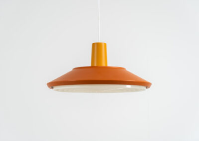 Midcentury pendant light (Denmark, 1960s). It’s made out of an aluminium shade, lacquered in a rusty orange/brown color. Due to the light diffusers on the top and bottom of the lamp there is no direct light harming the eyes. It is restored to perfection and newly rewired. Ready for another lifetime.