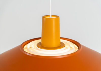 Midcentury pendant light (Denmark, 1960s). It’s made out of an aluminium shade, lacquered in a rusty orange/brown color. Due to the light diffusers on the top and bottom of the lamp there is no direct light harming the eyes. It is restored to perfection and newly rewired. Ready for another lifetime.