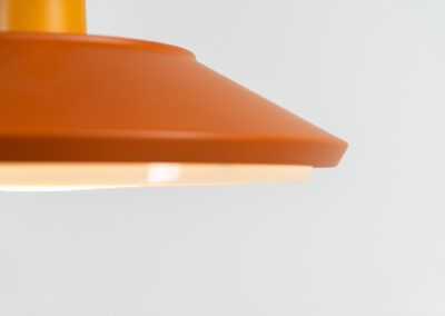 Midcentury pendant light (Denmark, 1960s). It’s made out of an aluminium shade, lacquered in a rusty orange/brown color. Due to the light diffusers on the top and bottom of the lamp there is no direct light harming the eyes. It is restored to perfection and newly rewired. Ready for another lifetime.