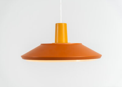 Midcentury pendant light (Denmark, 1960s). It’s made out of an aluminium shade, lacquered in a rusty orange/brown color. Due to the light diffusers on the top and bottom of the lamp there is no direct light harming the eyes. It is restored to perfection and newly rewired. Ready for another lifetime.