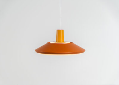 Midcentury pendant light (Denmark, 1960s). It’s made out of an aluminium shade, lacquered in a rusty orange/brown color. Due to the light diffusers on the top and bottom of the lamp there is no direct light harming the eyes. It is restored to perfection and newly rewired. Ready for another lifetime.