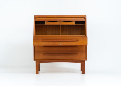 Rare secretary by Bernhard Pedersen & Son (Denmark, 1960s). This is an example of high quality Danish craftsmanship. It features stunning aesthetics and nifty details like the tambour door that opens automatically if you pull the upper drawer or the slidable tray inside the upper drawer. It is in very good condition and marked by the maker on the bottom.