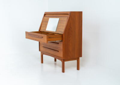 Rare secretary by Bernhard Pedersen & Son (Denmark, 1960s). This is an example of high quality Danish craftsmanship. It features stunning aesthetics and nifty details like the tambour door that opens automatically if you pull the upper drawer or the slidable tray inside the upper drawer. It is in very good condition and marked by the maker on the bottom.