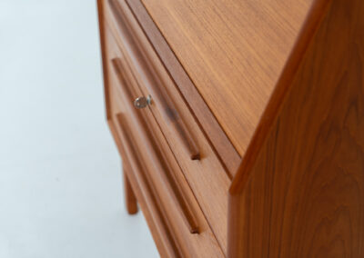 Rare secretary by Bernhard Pedersen & Son (Denmark, 1960s). This is an example of high quality Danish craftsmanship. It features stunning aesthetics and nifty details like the tambour door that opens automatically if you pull the upper drawer or the slidable tray inside the upper drawer. It is in very good condition and marked by the maker on the bottom.