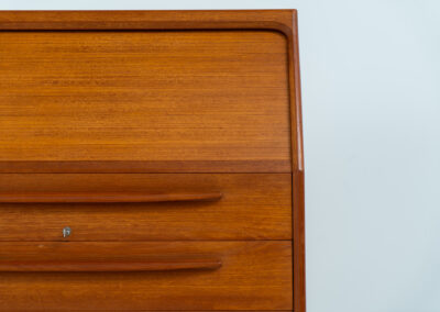 Rare secretary by Bernhard Pedersen & Son (Denmark, 1960s). This is an example of high quality Danish craftsmanship. It features stunning aesthetics and nifty details like the tambour door that opens automatically if you pull the upper drawer or the slidable tray inside the upper drawer. It is in very good condition and marked by the maker on the bottom.
