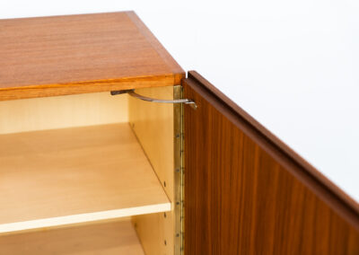 Iconic B60 sideboard in teak by Dieter Wäckerlin for Behr (Germany, 1950s). This highly sought after and significant “B60” sideboard is a masterful blend of minimalistic design and functional elegance. It’s unbelievable this piece was made in the 50’s and is yet so timeless. It contains four drawers and four doors with a minimal gap between them. The inside offers lots of storage space with adjustable shelves. It is in amazing condition with just one minor repair mark, visible on the pictures.