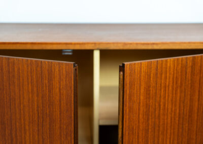Iconic B60 sideboard in teak by Dieter Wäckerlin for Behr (Germany, 1950s). This highly sought after and significant “B60” sideboard is a masterful blend of minimalistic design and functional elegance. It’s unbelievable this piece was made in the 50’s and is yet so timeless. It contains four drawers and four doors with a minimal gap between them. The inside offers lots of storage space with adjustable shelves. It is in amazing condition with just one minor repair mark, visible on the pictures.