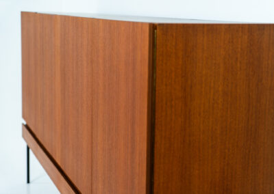 Iconic B60 sideboard in teak by Dieter Wäckerlin for Behr (Germany, 1950s). This highly sought after and significant “B60” sideboard is a masterful blend of minimalistic design and functional elegance. It’s unbelievable this piece was made in the 50’s and is yet so timeless. It contains four drawers and four doors with a minimal gap between them. The inside offers lots of storage space with adjustable shelves. It is in amazing condition with just one minor repair mark, visible on the pictures.