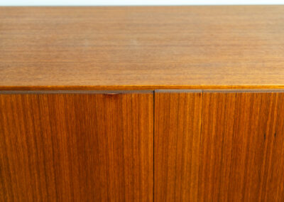 Iconic B60 sideboard in teak by Dieter Wäckerlin for Behr (Germany, 1950s). This highly sought after and significant “B60” sideboard is a masterful blend of minimalistic design and functional elegance. It’s unbelievable this piece was made in the 50’s and is yet so timeless. It contains four drawers and four doors with a minimal gap between them. The inside offers lots of storage space with adjustable shelves. It is in amazing condition with just one minor repair mark, visible on the pictures.