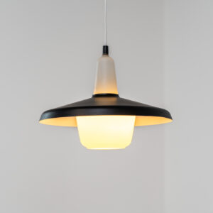 Danish opaline pendant light, 1960s. A beautiful lamp made of an opaline body and a black lacquered aluminium shade. In good condition. Newly rewired. Danish opaline pendant light, 1960s. A beautiful lamp made of an opaline body and a black lacquered aluminium shade. In good condition. Newly rewired.