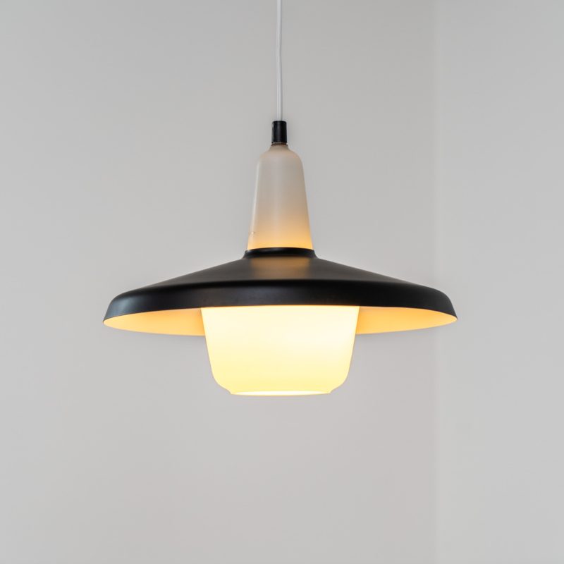 Danish opaline pendant light, 1960s. A beautiful lamp made of an opaline body and a black lacquered aluminium shade. In good condition. Newly rewired. Danish opaline pendant light, 1960s. A beautiful lamp made of an opaline body and a black lacquered aluminium shade. In good condition. Newly rewired.