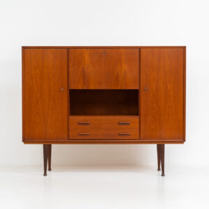 Teak highboard by van Pelt Belgium (Belgium, 1960s). A minimalistic piece made with high quality. It contains two doors with adjustable shelves on this inside, a drop-door with storage space for glasses and bottles, two drawers and an open shelve. The lock of the right door doesn’t work anymore, the key is fixed and the door closes with a magnet. The other locks still work smoothly. The wood is in very good condition with a few spots on the top and on the right side.