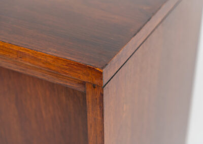 Belgian modernist bar cabinet in rosewood, 1960s. It features a minimalistic design with sleek lines and chrome details. It contains two big and two small sliding doors with lots of storage space on the inside. There are clearly traces of use and age like scratches and some color differences, but overall in good condition. We have a matching sideboard in stock aswell.