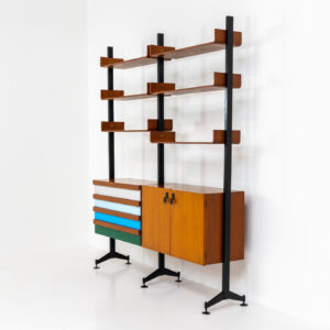 Italian modular wall unit / room devider, 1950s. A wonderful piece combining beautiful shapes, quality and a touch of color. It features a chest of drawers with drawers in four colors, a cabinet with two doors, black steal legs and six very nicely curved shelves. The designer is unknown for now but it’s definitely a stunning piece. The back is finished aswell so it can perfectly serve as a room devider. In very good condition!
