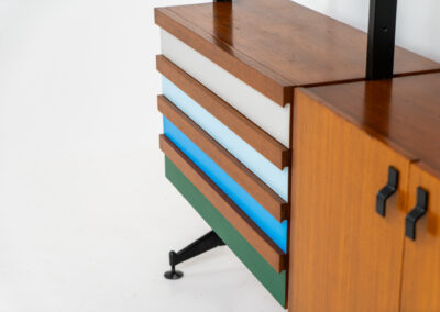 Italian modular wall unit / room devider, 1950s. A wonderful piece combining beautiful shapes, quality and a touch of color. It features a chest of drawers with drawers in four colors, a cabinet with two doors, black steal legs and six very nicely curved shelves. The designer is unknown for now but it’s definitely a stunning piece. The back is finished aswell so it can perfectly serve as a room devider. In very good condition!