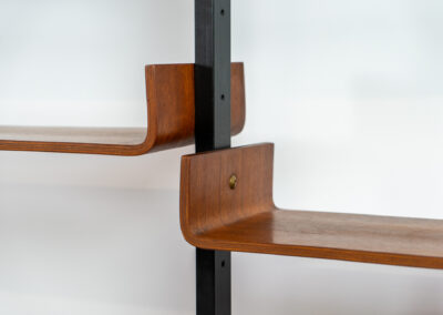 Italian modular wall unit / room devider, 1950s. A wonderful piece combining beautiful shapes, quality and a touch of color. It features a chest of drawers with drawers in four colors, a cabinet with two doors, black steal legs and six very nicely curved shelves. The designer is unknown for now but it’s definitely a stunning piece. The back is finished aswell so it can perfectly serve as a room devider. In very good condition!