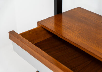 Italian modular wall unit / room devider, 1950s. A wonderful piece combining beautiful shapes, quality and a touch of color. It features a chest of drawers with drawers in four colors, a cabinet with two doors, black steal legs and six very nicely curved shelves. The designer is unknown for now but it’s definitely a stunning piece. The back is finished aswell so it can perfectly serve as a room devider. In very good condition!