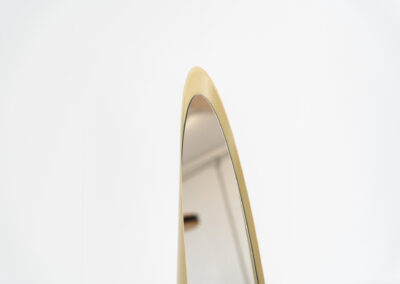 Crème “Unghia” mirror by Rodolfo Bonetto (Italy, 1970s). This elegant Unghia mirror, also known as the lipstick mirror is made out of a fiberglass body lacquered in a creamy beige color. The item remains in good condition with age-related sings on the body, such as some scratches and scuffs in the lacquer.