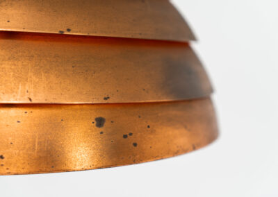 Early copper “Beehive” pendant light by Hans-Agne Jakobsson for AB Markaryd (Sweden, 1950s). Presenting this striking centerpiece. It is crafted from solid copper, and it’s age has blessed it with a stunning patina that really enhances its charm and character. It is in good and original condition and the original diffuser is still intact, the diffuser can easily be removed if you prefer the lamp without it like we do.
