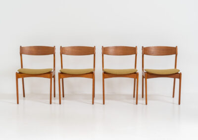 Set of 4 “Model 49” dining chairs by Erik Buch for O.D. Møbler (Denmark, 1954). A stunning, high-quality design featuring solid teak frames, a generously curved teak backrest, and signature floating seats, newly upholstered in a wonderful mustard/khaki fabric. The chairs remain in splendid condition! Marked by maker.