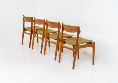 Set of 4 “Model 49” dining chairs by Erik Buch for O.D. Møbler (Denmark, 1954). A stunning, high-quality design featuring solid teak frames, a generously curved teak backrest, and signature floating seats, newly upholstered in a wonderful mustard/khaki fabric. The chairs remain in splendid condition! Marked by maker.