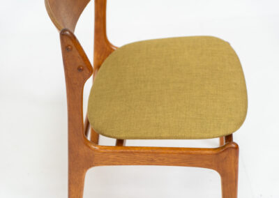 Set of 4 “Model 49” dining chairs by Erik Buch for O.D. Møbler (Denmark, 1954). A stunning, high-quality design featuring solid teak frames, a generously curved teak backrest, and signature floating seats, newly upholstered in a wonderful mustard/khaki fabric. The chairs remain in splendid condition! Marked by maker.
