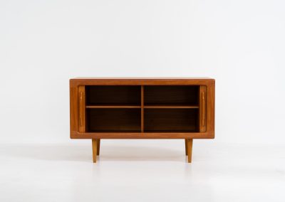 Svend Dyrlund teak sideboard with tambour doors (Denmark, 1960s). A wonderful sideboard with sought after dimensions. It perfectly combines very organic shapes and loads of detail, like the tambour sliding doors and the beautiful handles. It offers lots of storage space with two adjustable shelves on the inside. In splendid condition
